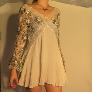 White bell sleeve dress with floral lace and tie